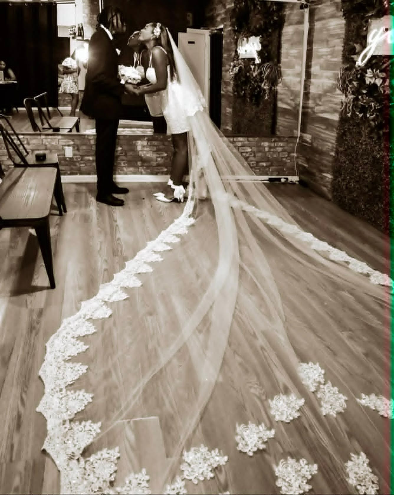 Couple sharing their first kiss as newlyweds
